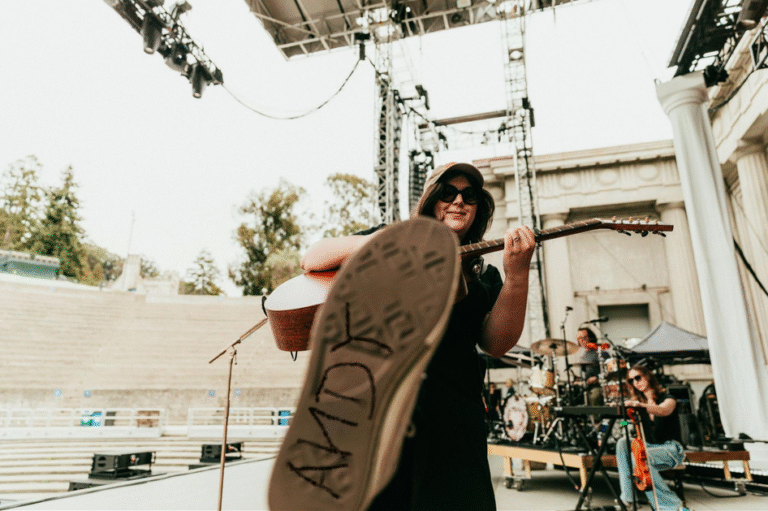 Lucy Dacus with Andy written on her shoe